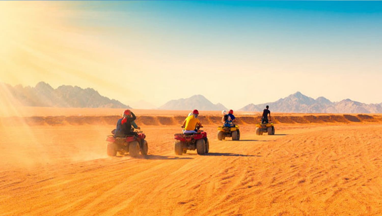 quad biking dubai, A group of friends quad biking in open desert dubai